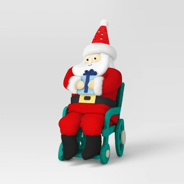 Santa Fabric Christmas Figurine in Wheelchair Holding Gift - Wondershop