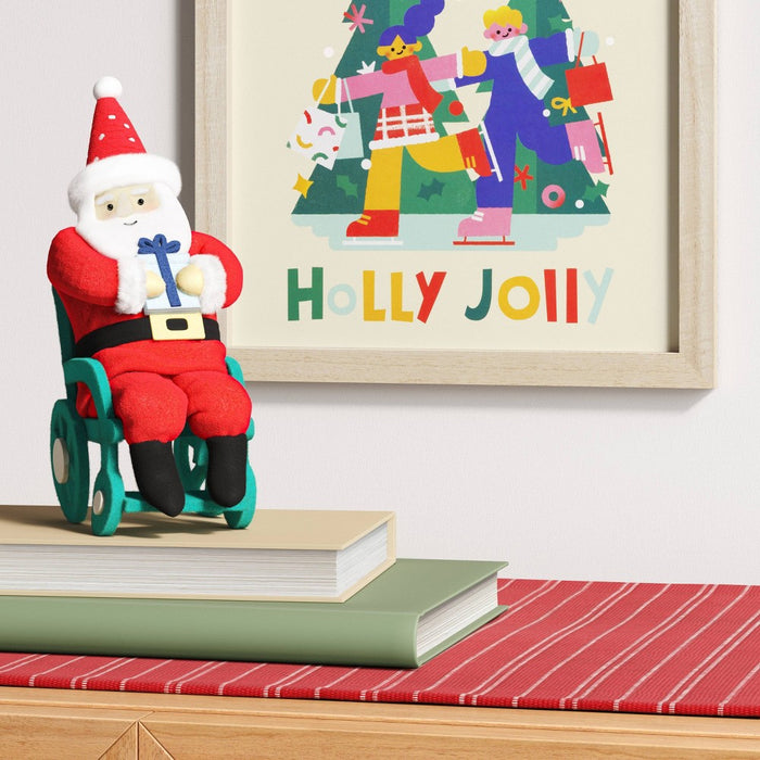 Santa Fabric Christmas Figurine in Wheelchair Holding Gift - Wondershop