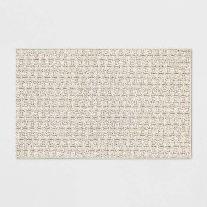 2'6"x3'10" Washable Solid Machine Tufted Accent Rug Tan - Threshold