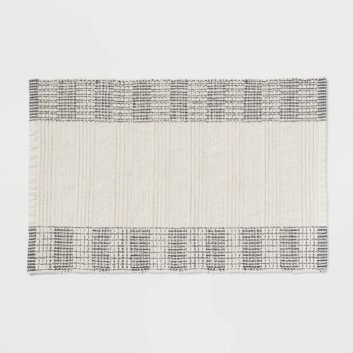 24"x36" Oversized Modern Chenille Bath Rug Black/White - Threshold