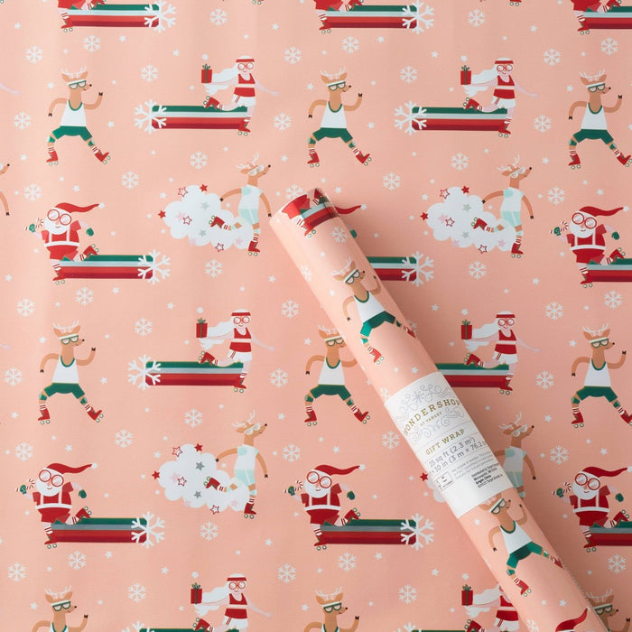 25 sq ft Roller Skating Santa Gift Wrap Pink - Wondershop