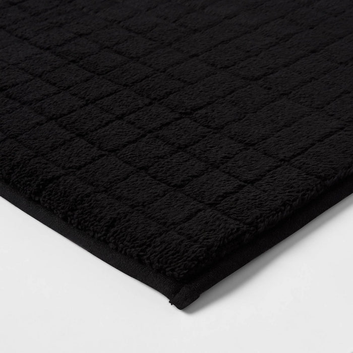17"x24" Velveteen Grid Memory Foam Bath Rug Black - Room Essentials