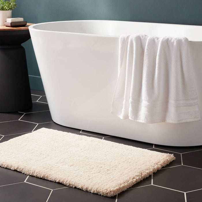21"x34" Spa Plush Bath Rug Almond - Threshold