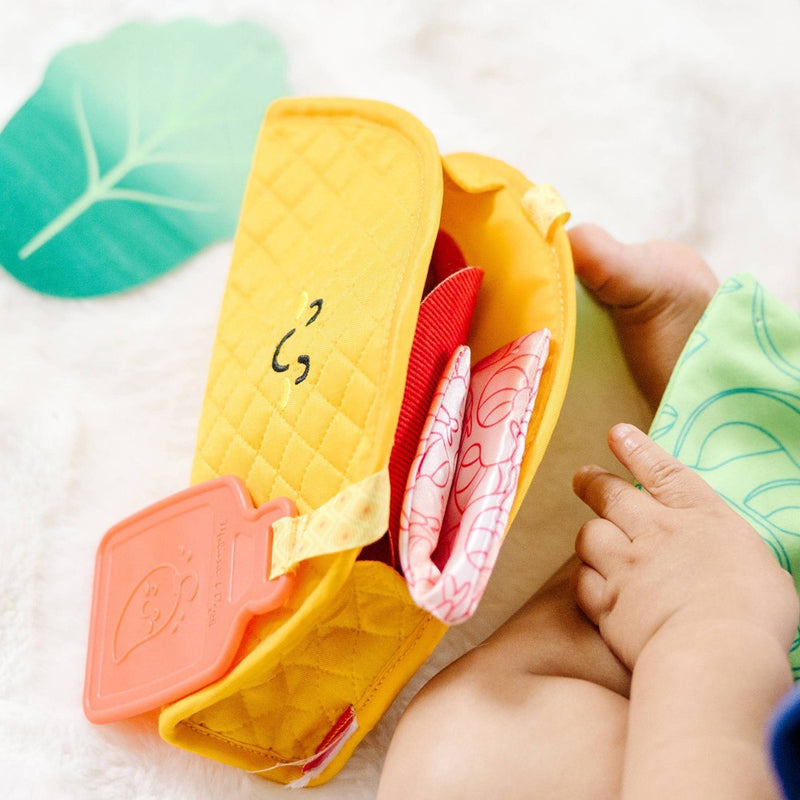 Melissa & Doug Multi-Sensory Soft Taco Fill & Spill Infant Toy