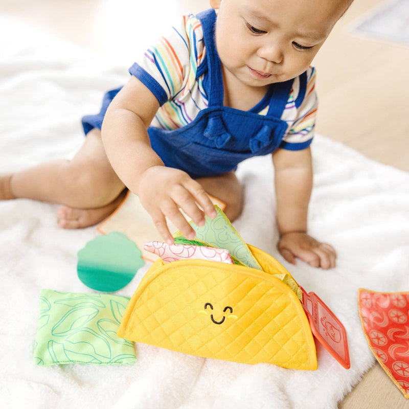 Melissa & Doug Multi-Sensory Soft Taco Fill & Spill Infant Toy