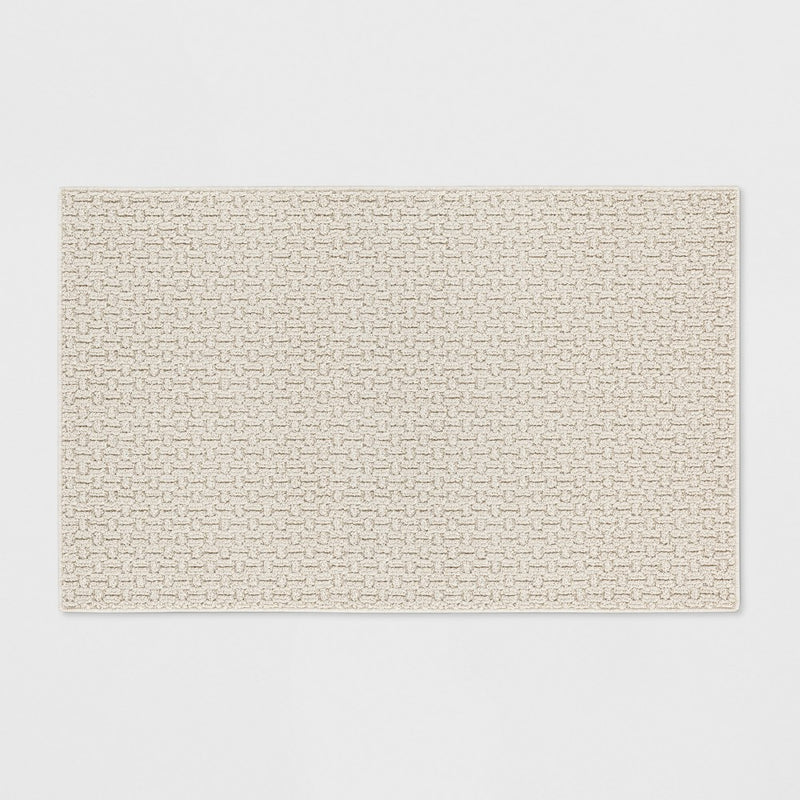 2'6"x3'10" Washable Solid Machine Tufted Accent Rug Tan - Threshold
