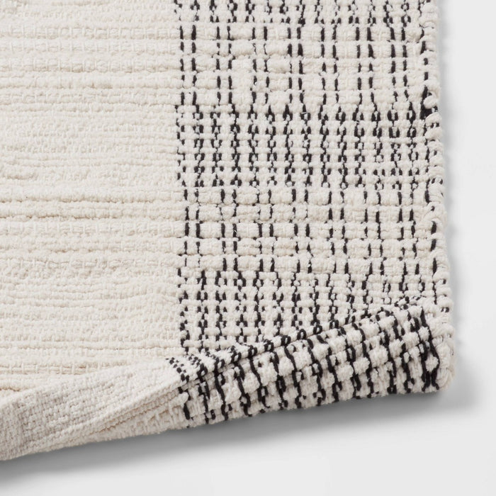 24"x36" Oversized Modern Chenille Bath Rug Black/White - Threshold