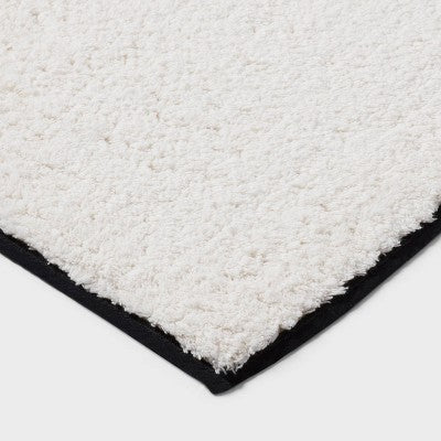 24"x36" Oversized Border Bath Rug Black/White - Threshold