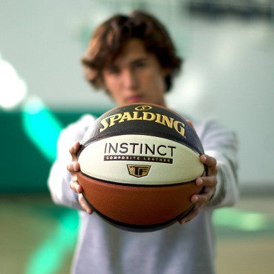 Spalding Instinct 27.5" Basketball: Composite, Butyl Bladder, Youth Use