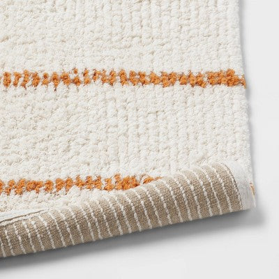 20"x30" Modern Tufted Stripe Bath Rug Yellow/Cream - Threshold