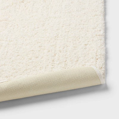 20"x34" Performance Plus Plush Non Skid Bath Rug Cream - Threshold