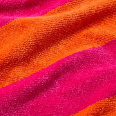 36"x72" Reversible Diagonal Striped Oversized Beach Towel Pink/Orange - Room Essentials